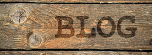 A wood with letters carved into it