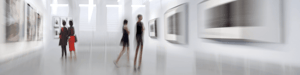 A blurry image of people walking in a museum