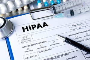 A medical form with a pen and syringe
