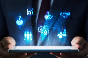 A person holding a tablet with icons